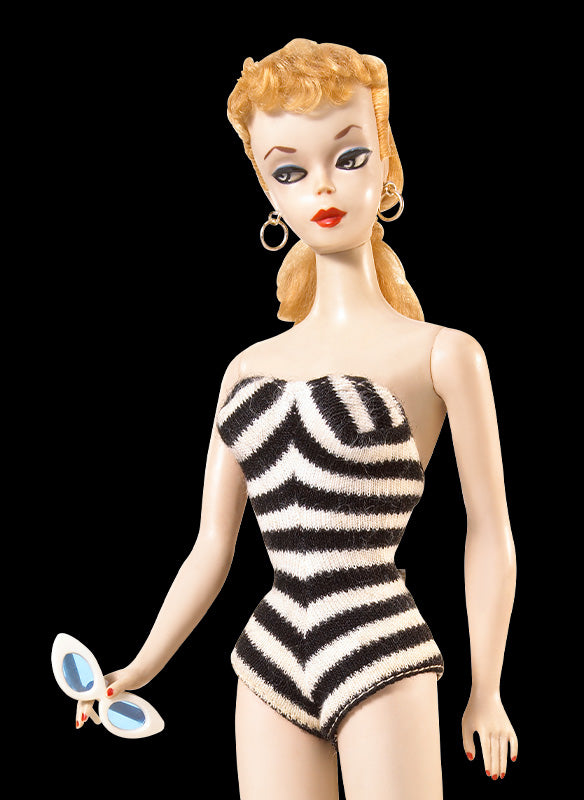 Original 1959 Barbie doll in a black-and-white zebra-print swimsuit with signature blonde ponytail