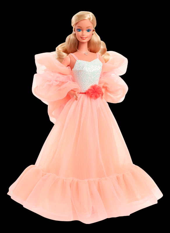 1985 Peaches 'n Cream Barbie doll in a flowing peach gown, one of the most collectible dolls of the 1980s