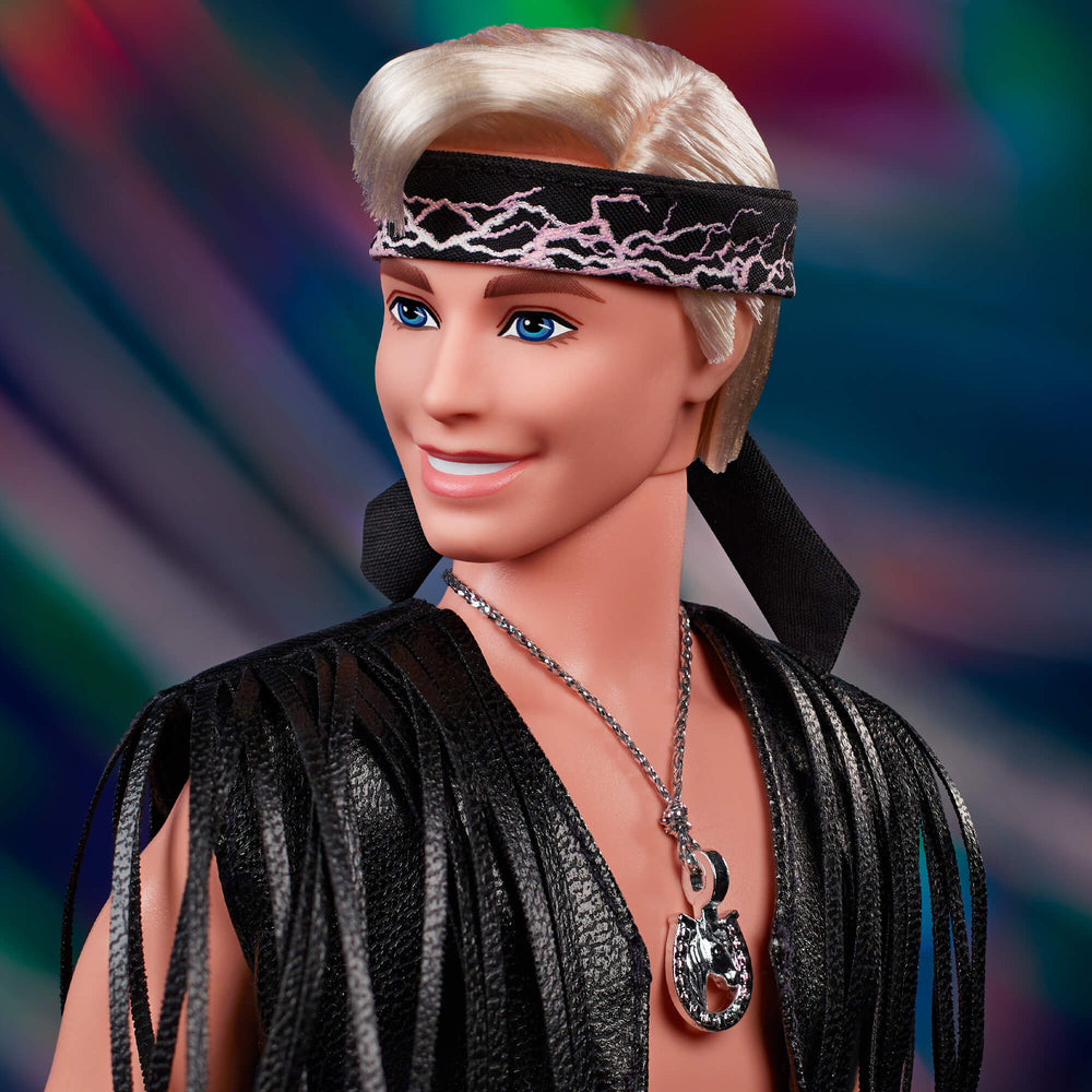 Ken Doll in Faux Fur Coat and Black Fringe Vest – Barbie The Movie